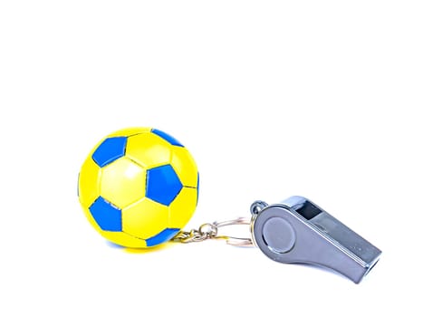 Soccer ball and referee's whistle on a white background. Sport. Championship. Europe. World. Background image. Place for text.