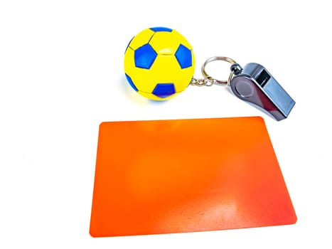 Soccer ball and referee whistle with cards on a white background. Sport. Championship. Europe. World. Background image. Place for text.