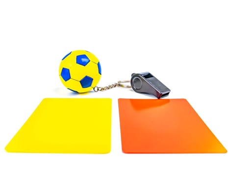 Soccer ball and referee whistle with cards on a white background. Sport. Championship. Europe. World. Background image. Place for text.