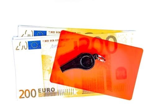 Warning cards and money of a football referee.. Corruption of a football referee for money. Money. Soccer referee cards. Sport. Tote. Bribe. Rates. Bribe. Place for text. Euro currency. Dollar.