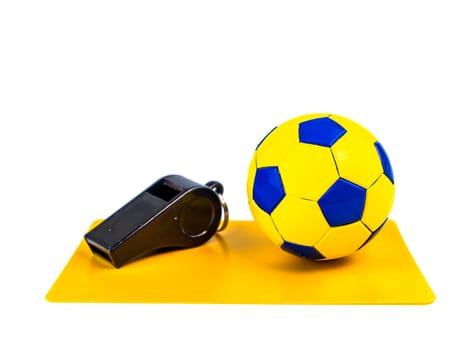 Soccer ball and yellow card with the whistle of a soccer referee on a white background. Football. Championship. World. Europe. Referee. Place for text.