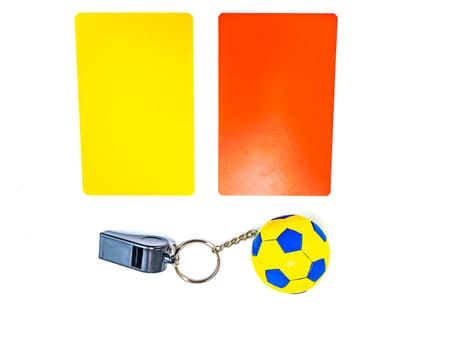 Soccer ball and referee whistle with cards on a white background. Sport. Championship. Europe. World. Background image. Place for text.