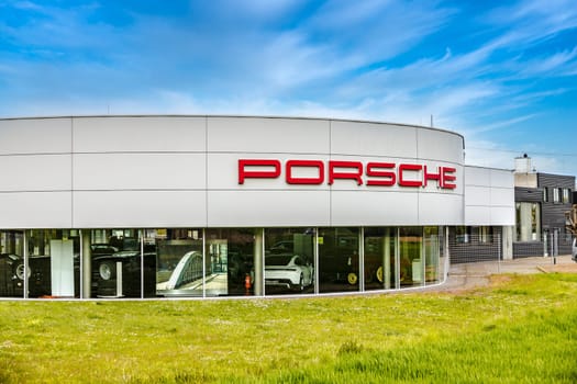 GIESSEN, GERMANY 2021-05-08: Porsche Zentrum GIESSEN-WETTENBERG Porsche is a German automobile manufacturer specializing in high-performance sports cars, SUVs and sedans.