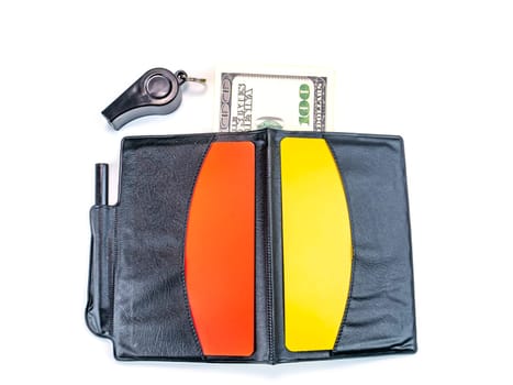 Warning cards and money of a football referee.. Corruption of a football referee for money. Money. Soccer referee cards. Sport. Tote. Bribe. Rates. Bribe. Place for text. Euro currency. Dollar.