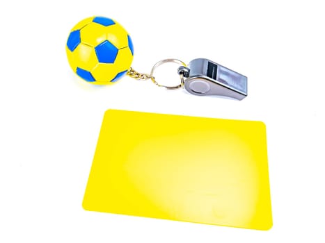 Soccer ball and referee whistle with cards on a white background. Sport. Championship. Europe. World. Background image. Place for text.