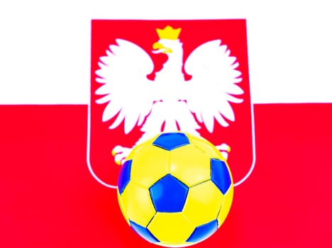 Soccer ball on the background of the flag of Poland. Championship. World. Europe. Place for text.