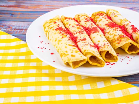 Pancakes on a plate on a pancake day. Fat Tuesday. Mardi Gras. Fastnacht. Vastlavya. Maslenitsa. Leftovers. Food photo.