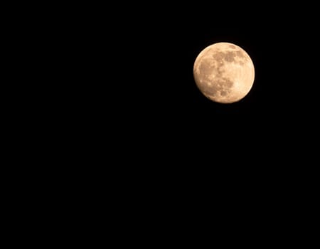 The moon against the black night sky. Nature. Space. Scenery. Background image.