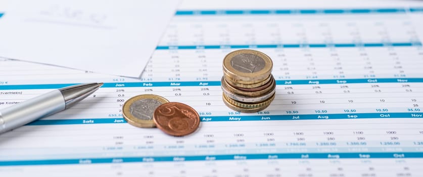 Financial documents with coins