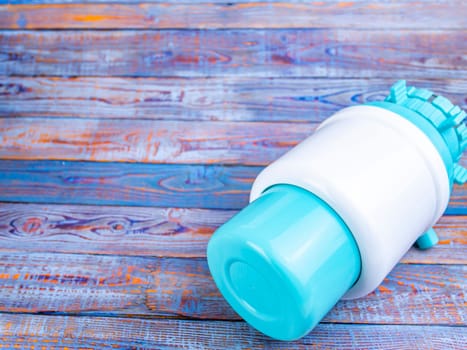 Pump for a bottle of water on the table. Place for text. Background image. Technology.