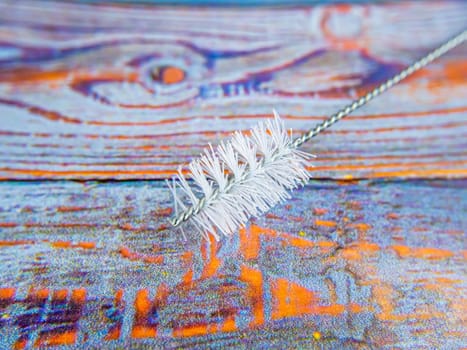 Brush for washing bottles and artificial bristles. Place for text. Background image. Technology. Kitchen tool.