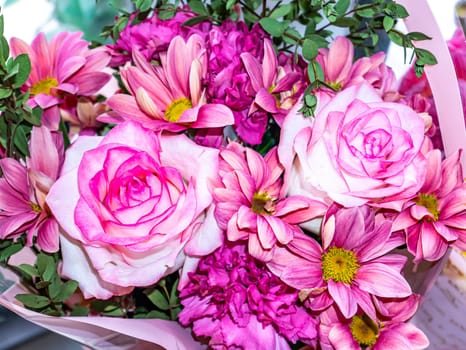 Festive bouquet of garden flowers of pink roses and pyrethrum. Mothers Day. Birthday. Bridal bouquet. Day of Remembrance. International Women's Day. Place for text. Background image. Advertising.