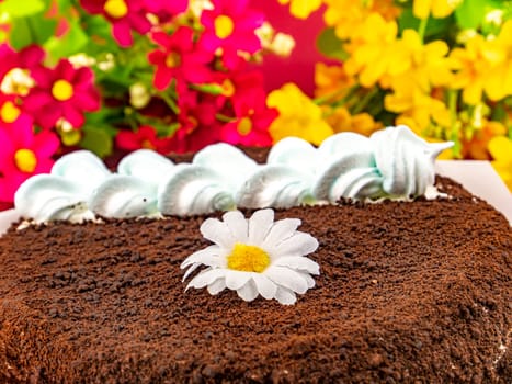 Festive chocolate cake with white biscuit cream. Food photo. Birthday cake. Shop window. Place for text. Sweets. Dessert. Cake baking. Background image.