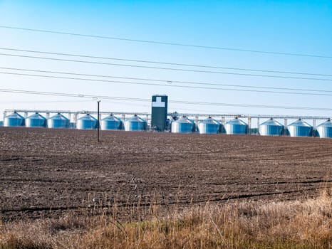 Metal containers for storage elevator on the horizon. Industry. Place for text. Background image.