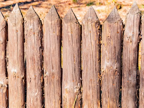 Background image of a wooden fence picket fence. Place for text. Background image.