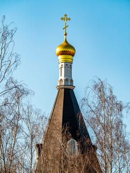Domes of the temple of the Ukrainian Orthodox Church against the blue sky. Religion. Easter. Christmas. Place for text.