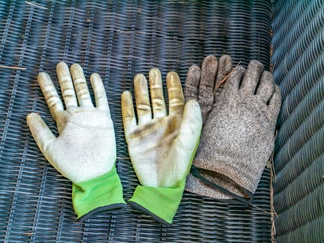 Dirty rag gloves of a gardener after work. Place for text. Background image. Tool.