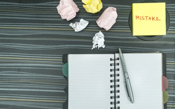 Mistake written on sticky notes. Learning, wrong, blooper, error, regret sayings background. Fault, defect, careless, lesson correction and reconciliation concept for love relationship. Flat lay