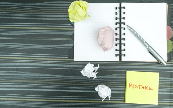 Mistake written on sticky notes. Learning, wrong, blooper, error, regret sayings background. Fault, defect, careless, lesson correction and reconciliation concept for love relationship. Flat lay