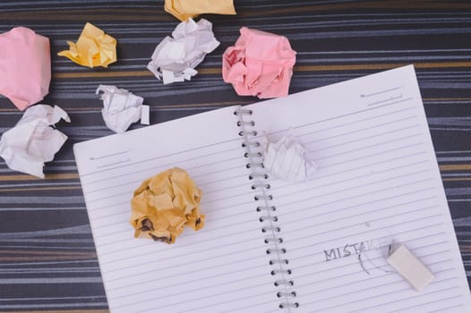 Erasing Mistake on notepad. Learning, wrong, blooper, regret sayings background. Fault, defect, careless, lesson correction and reconciliation thought concept for love friendship relationship.