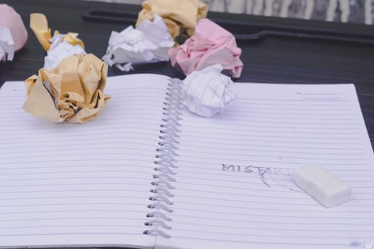 Erasing Mistake on notepad. Learning, wrong, blooper, regret sayings background. Fault, defect, careless, lesson correction and reconciliation thought concept for love friendship relationship.