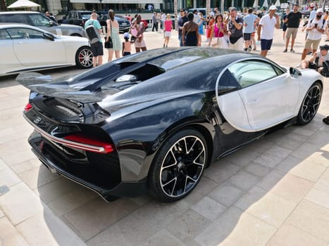 Monte-Carlo, Monaco - July 24, 2021: White Bugatti Chiron Luxury Supercar Parked In Front Of The Monte-Carlo Casino In Monaco On The French Riviera, Europe - Rear Side View.