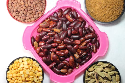 Top view of assortment of cereals, and cardamom. Collection of different spices and cereals.