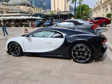 Monte-Carlo, Monaco - July 24, 2021: Beautiful White Bugatti Chiron Luxury Supercar Parked In Front Of The Monte-Carlo Casino In Monaco On The French Riviera, Europe - Side View.