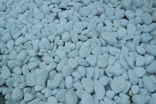 Top view of white stones background.