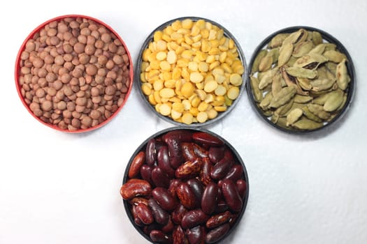 Top view of assortment of cereals, and cardamom. Collection of different spices and cereals.