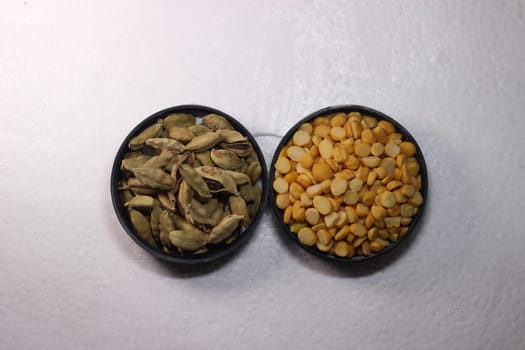 Top view of assortment of cereals, and cardamom. Collection of different spices and cereals.