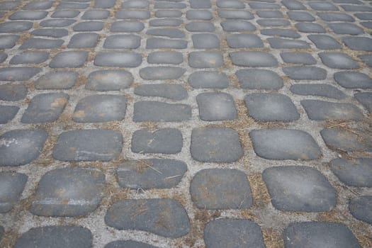 Closeup texture of brick floor. A background of a weathered old exterior brick floor with copy space for text