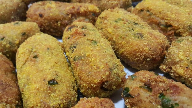 Closeup perspective view of home made spicy and delicious croquettes served with tea or other dishes during parties as fast food.