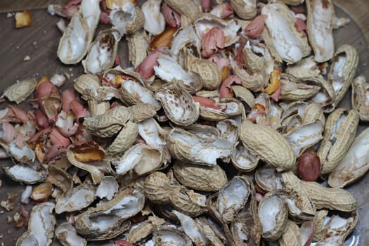 Empty peanut shells spread over floor. Peanut Shell Background.