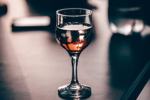 Wine tasting experience at the wine bar: red wine on the table.
