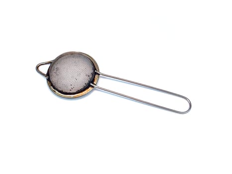 Metal strainer for coffee and tea on a white background. Making tea and coffee. Hot drinks. Kitchen tool. Filter. Home kitchen. Background image. Place for your text. Template.