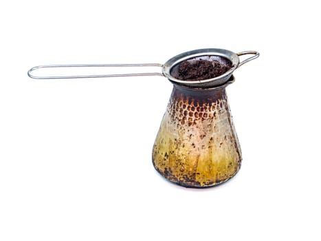 Metal strainer for coffee on a white background. Coffee maker. Hot drinks. Kitchen tool. Filter. Home kitchen. Background image. Place for your text. Template.