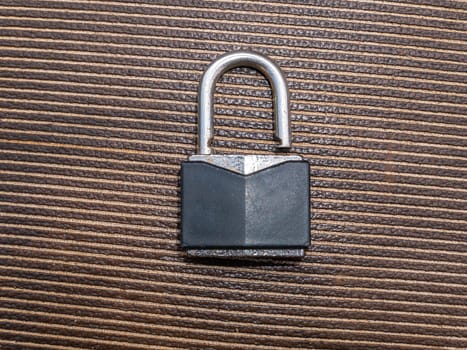 Iron padlock for locking gates and doors. Iron door padlock. Safe storage. Security of property. Protection of material assets. Metal product. Place for your text. Burglary and theft protection.