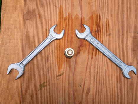Iron wrenches for loosening bolts and nuts. Locksmith tools for loosening bolts and nuts. Removable wrench caps. Car mechanic metal tool. Repair mechanic's tool. Repair service for equipment.