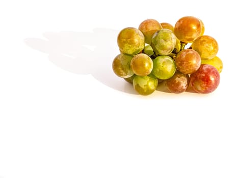 Harvest grapes berries on a white background. Grape juice. Winemaking. Wine production. Fruit shop showcase. Grape gardening. Agriculture. Place for text. Dried fruits. Garden fruits.