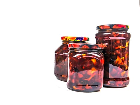 Canned fruits and vegetables in glass jars. Apple jam. Pickled vegetables. Harvest conservation for the winter. Marinate in a glass jar. Recipe. Home kitchen. Menu. Salting food. Food preparation.