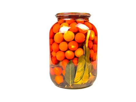 Canned tomato vegetable in a glass jar. Pickled vegetables tomatoes. Harvest conservation for the winter. Marinate in a glass jar. Recipe. Home kitchen. Menu. Salting food. Cooking food.