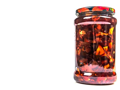 Canned fruits and vegetables in glass jars. Apple jam. Pickled vegetables. Harvest conservation for the winter. Marinate in a glass jar. Recipe. Home kitchen. Menu. Salting food. Food preparation.