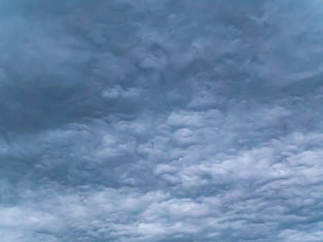 Cloudy landscape of stormy sky before rain. Weather. Non-flying weather. Hurricane. Thunderclouds. A storm warning. The approach of the apocalypse. Forecast by weather forecasters. Background.