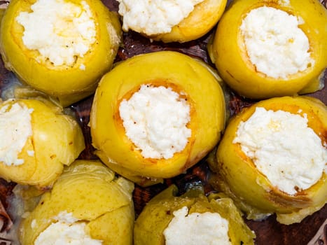 Baked apples stuffed with cottage cheese on a plate. Food photo. Apple vegetable. Recipe. Home kitchen. Bakery products. Advertising photo of a shop window. Menu of dishes. Place for text.