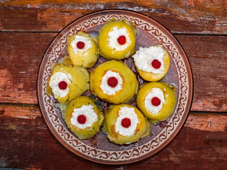 Baked apples stuffed with cottage cheese and raspberries. Food photo. Apple vegetable. Raspberries. Recipe. Home kitchen. Advertising photo of a shop window. Menu of dishes. Place for text.