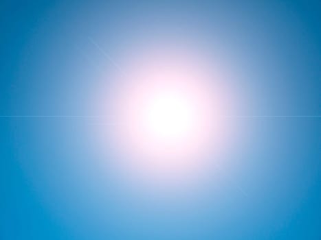 Sun rays on a background of blue sky. Natural background. Lens flare in the sun. Heavenly landscape. Space. Stratosphere. Background image. Poster. Place for text. Clear sky.