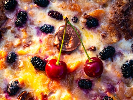 A cake decorated with two red cherries. Homemade baking. Dessert. Food photo. Recipe. Place for text. Poster. Advertising photo. Shop window. Bakery. Mulberries. Fruit cherry berries.