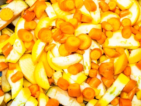 Sliced and peeled vegetables with onions and carrots for cooking. Food photo. Vegetable harvest. Home kitchen. Cooking food. Place for your text. Advertising photo of a shop window. Template.