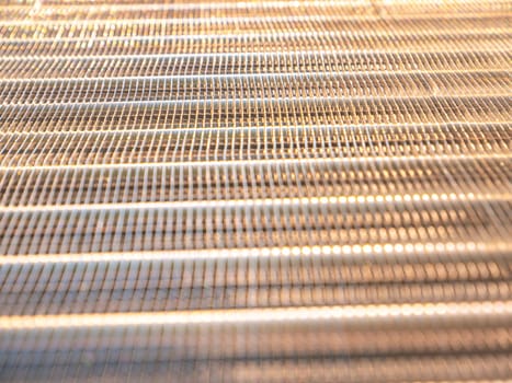Aluminum radiator for engine cooling and car air conditioning. Refrigeration system cooling condenser. Refrigerator evaporator. Car repair workshop. Refrigerator repair. Air conditioning system.